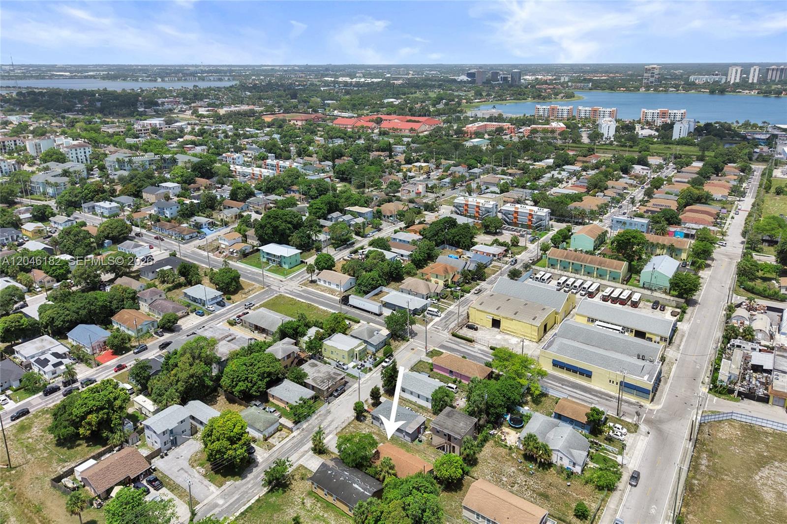An aerial view shows a residential neighborhood with a white arrow pointing to a house — 727 22nd St # B, West Palm Beach FL 33407, WEST PALM BEACH, FL