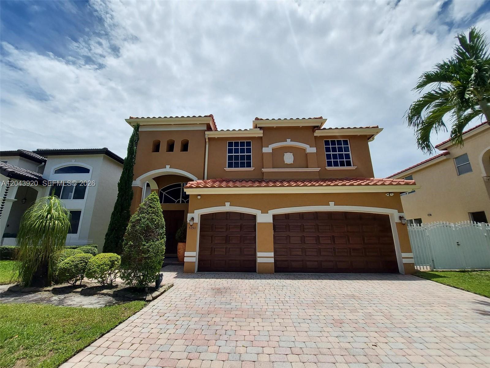 A two-story stucco house with a tile roof and a two-car garage — 5350 SW 130th Ter # 5350, Miramar FL 33027, MIRAMAR, FL