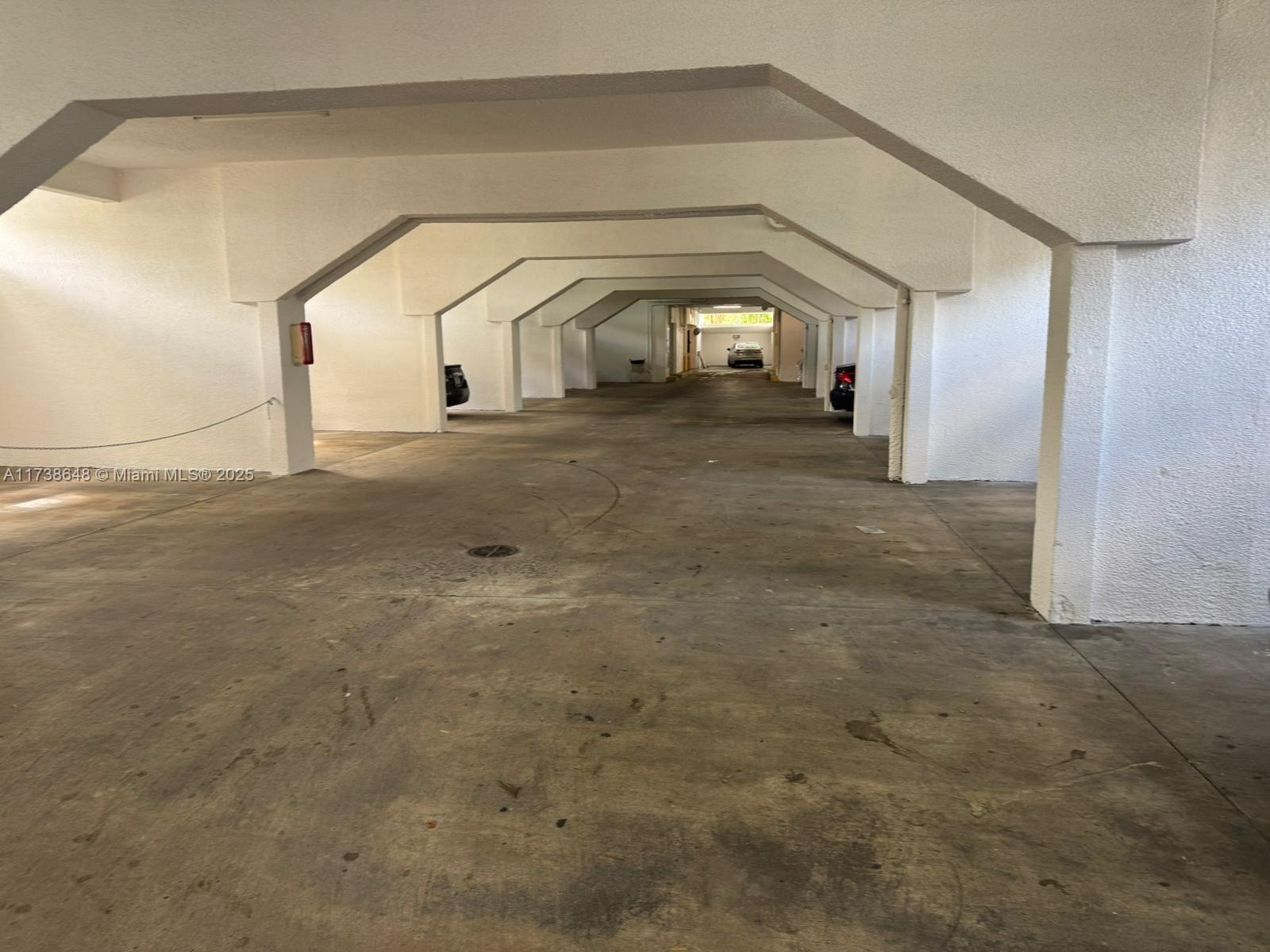 A straight wooden staircase with white railings leads to a closed door at the top — 3301 Spanish Moss Ter # 415, Lauderhill FL 33319, LAUDERHILL, FL