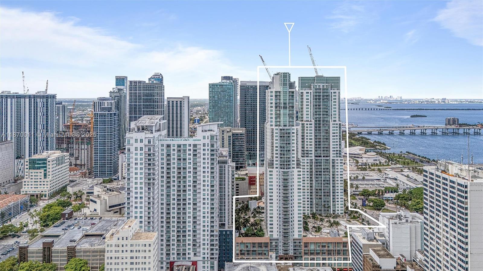An aerial view shows a tall residential skyscraper complex in a dense urban waterfront setting — 253 NE 2 ST # 626, Miami FL 33132, MIAMI, FL