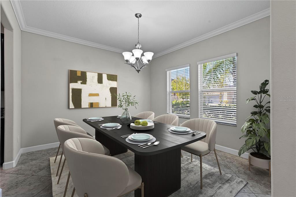 A dining room features a dark rectangular table, six beige chairs, and a chandelier — 3147 CALVANO DRIVE, LAND O LAKES, FL