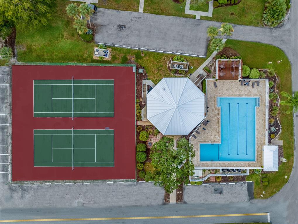 An aerial view shows two tennis courts, a swimming pool, and a gazebo — 11346 W BAYSHORE DRIVE UNIT 52, CRYSTAL RIVER, FL
