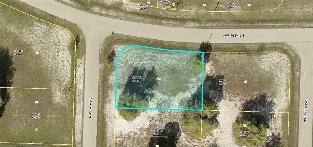 This is an aerial map showing a vacant corner lot highlighted in blue — 4621 NW 36TH PLACE, CAPE CORAL, FL