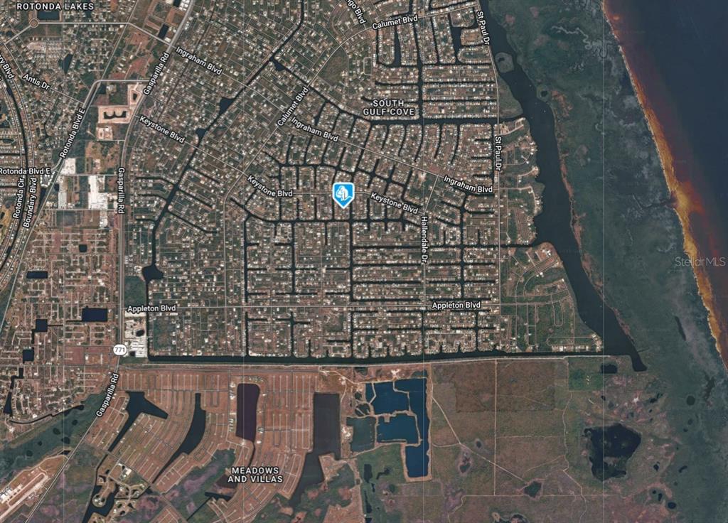 This is an aerial map view of a residential neighborhood with canal-front properties — 9533 PRESIDENT CIRCLE, PORT CHARLOTTE, FL