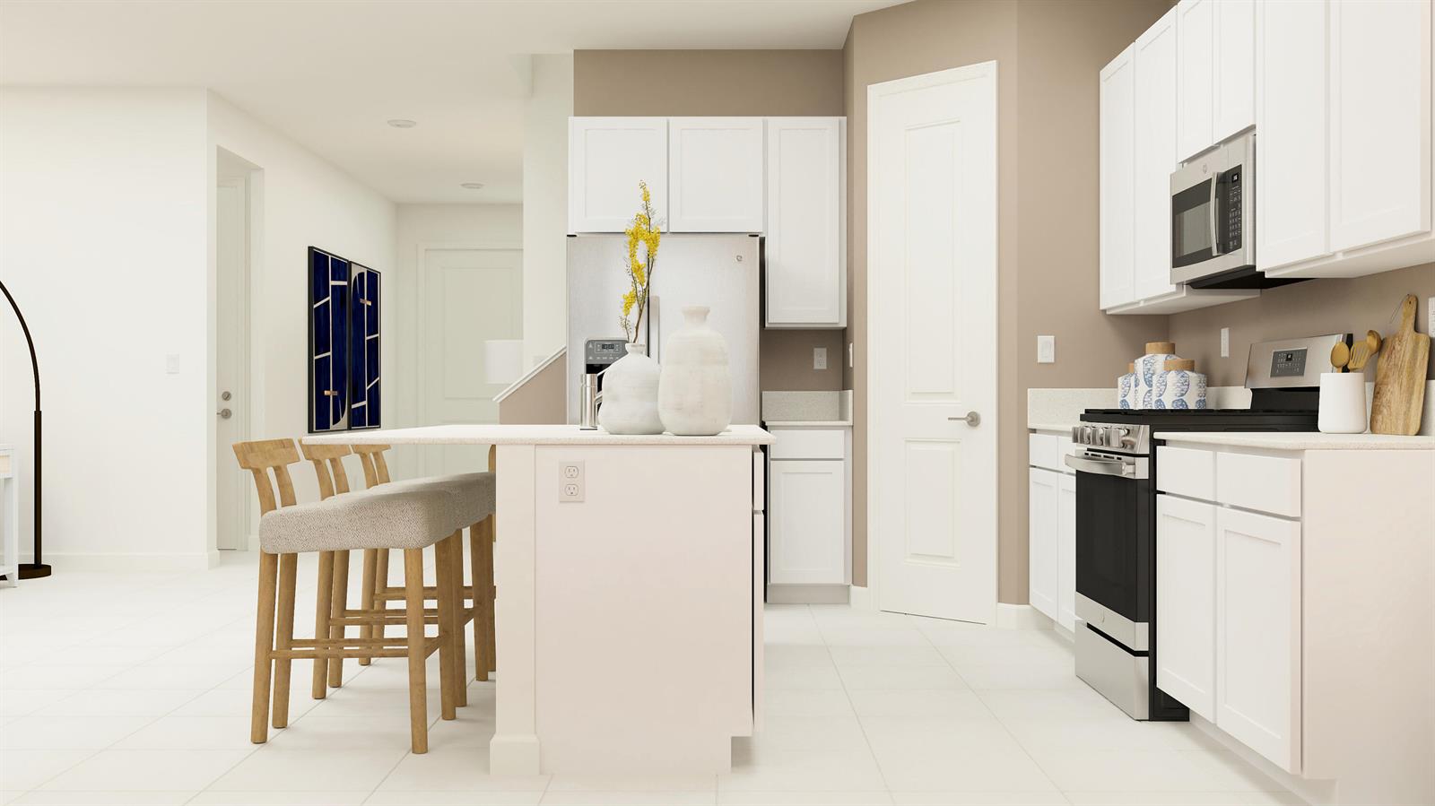 A kitchen features white cabinets, stainless steel appliances, a center island, and light-colored tile flooring — 1760 Wandering Willow Way, FL 33470, FL