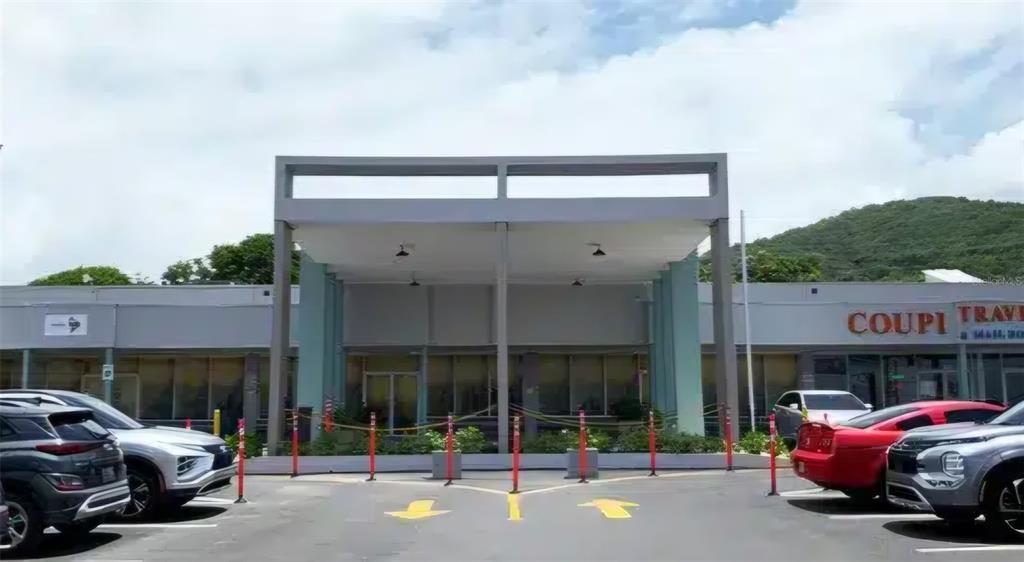 A commercial building exterior features a covered entrance with a gray frame and parking lot — 3 PR-3 KM. 45.5, FAJARDO, PR