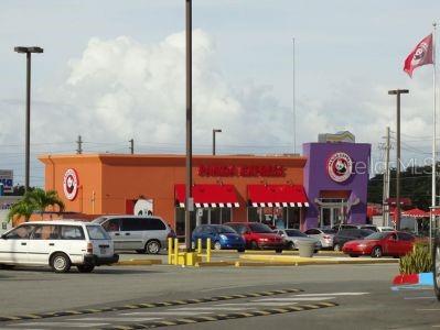 A Panda Express restaurant building with orange and purple walls stands in a parking lot — 3 PR-3 KM. 45.5, FAJARDO, PR