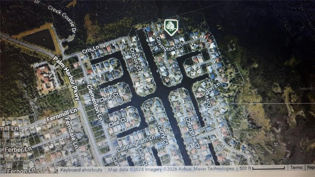 This is an aerial map view of a residential neighborhood featuring canals and cul-de-sacs — 4 COVENTRY PLACE, PALM COAST, FL