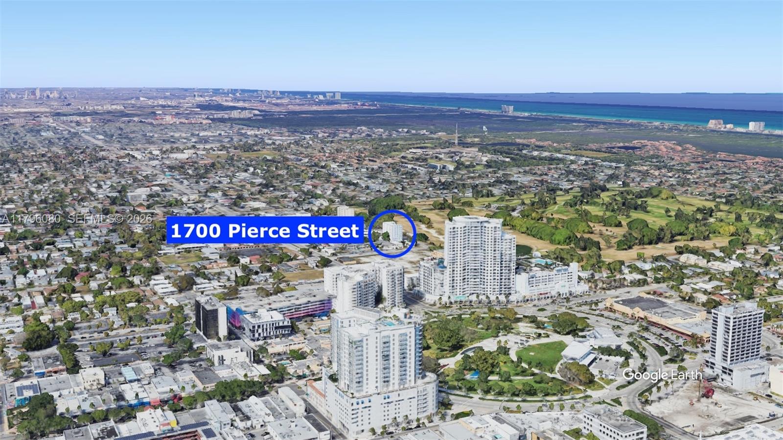 This is an aerial view rendering of a high-rise building located in a city — 1700 Pierce St # 202, Hollywood FL 33020, HOLLYWOOD, FL