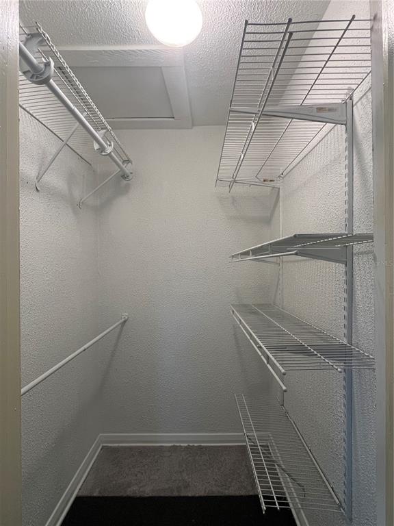 A small walk-in closet featuring white wire shelving and a hanging rod — 402 W PARIS STREET, TAMPA, FL