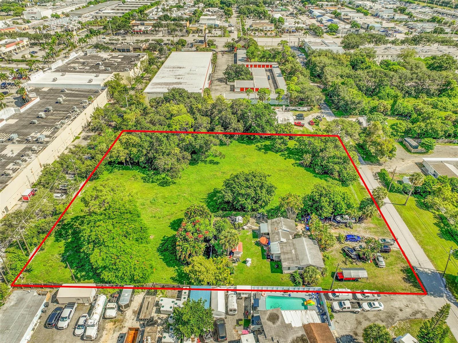 An aerial view shows a large, rectangular grassy lot with a house and mature trees — 1865 Donnell Road, West Palm Beach FL 33409, WEST PALM BEACH, FL