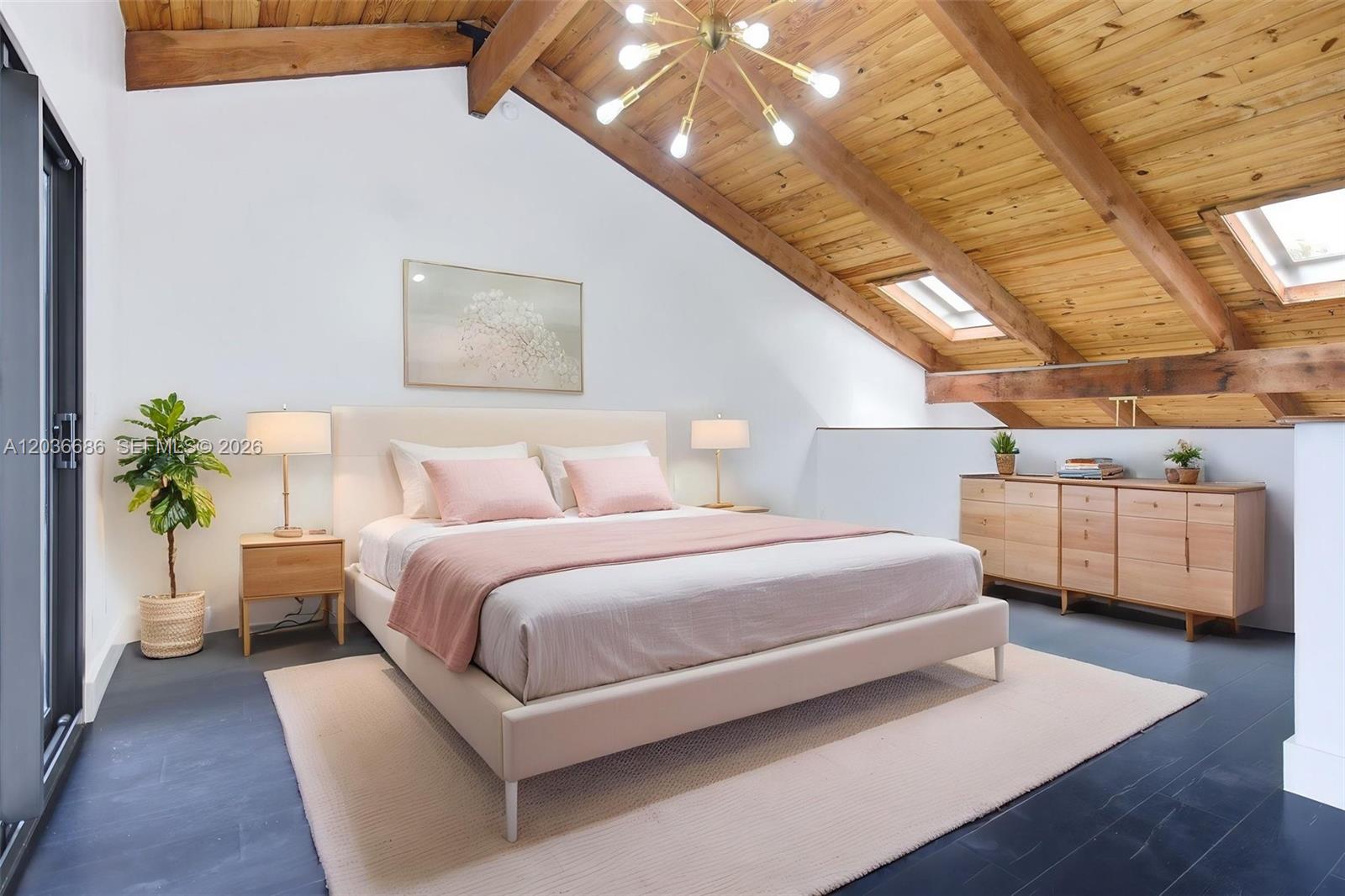 A bedroom features a vaulted wood-paneled ceiling, skylights, a bed, and dark flooring — 2152 SW 81st Way, Davie FL 33324, DAVIE, FL