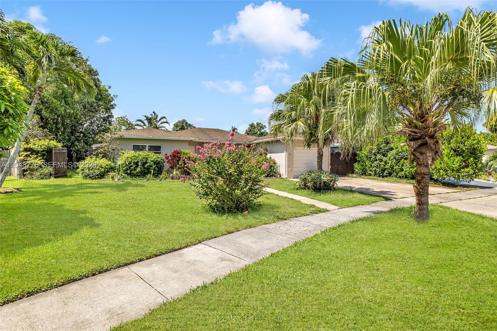 A single-story house with a lawn, palm trees, and a concrete walkway — 5045 SW 10th St, Margate FL 33068, MARGATE, FL