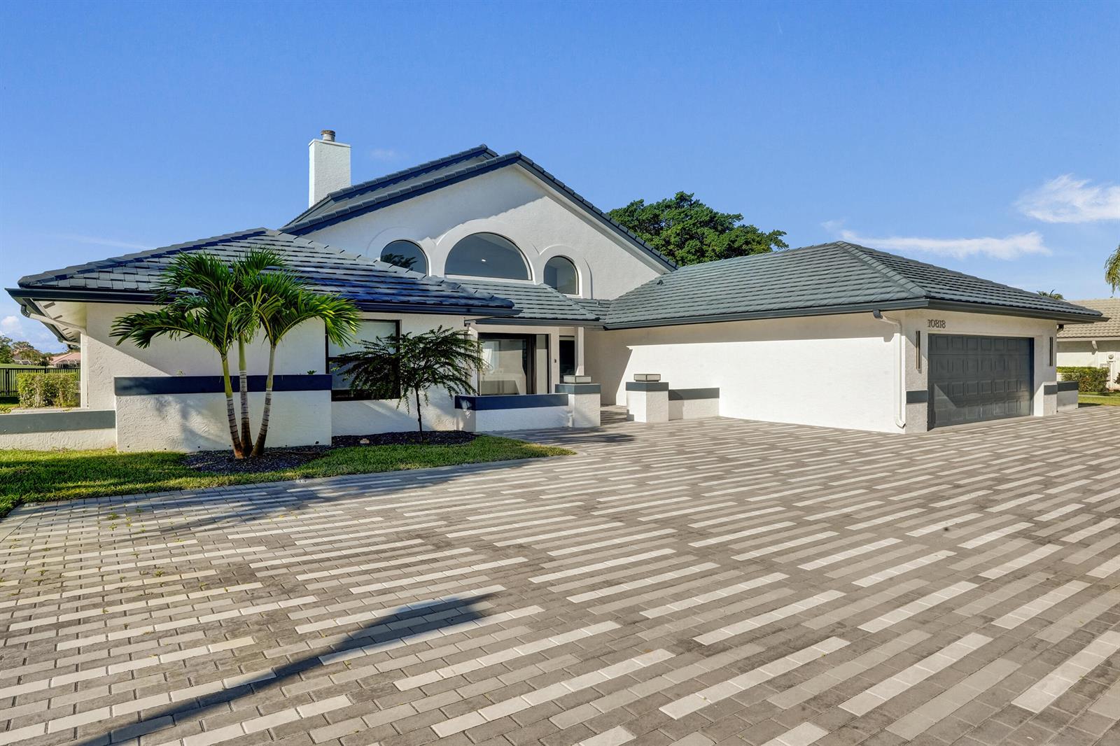 A white house with a dark tiled roof and a large paver driveway — 10818 River Glenn Drive, Boca Raton FL 33428, BOCA RATON, FL