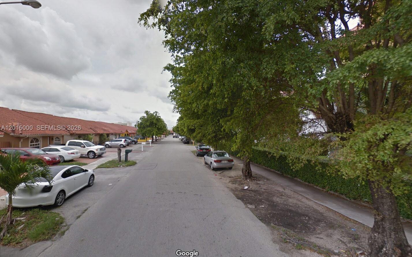 A street view shows a residential road lined with parked cars and mature trees — 5490 W 21st Ct # 313, Hialeah FL 33016, HIALEAH, FL