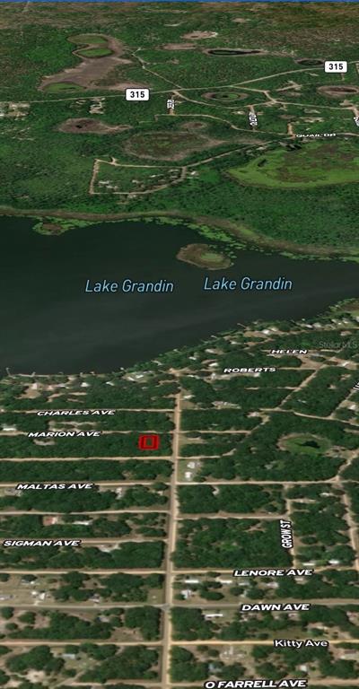 This is an aerial map showing a highlighted plot of land near Lake Grandin — LOT 2 MARION AVENUE, INTERLACHEN, FL