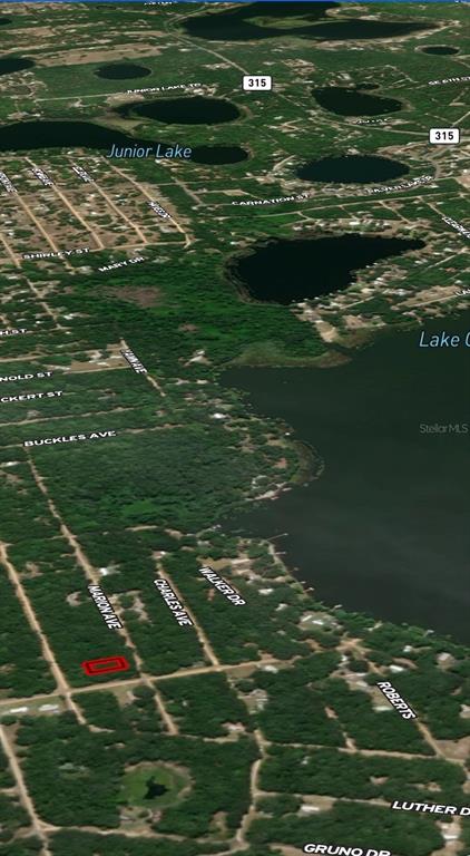 An aerial map view shows a red-outlined vacant lot near a lake and residential streets — LOT 2 MARION AVENUE, INTERLACHEN, FL