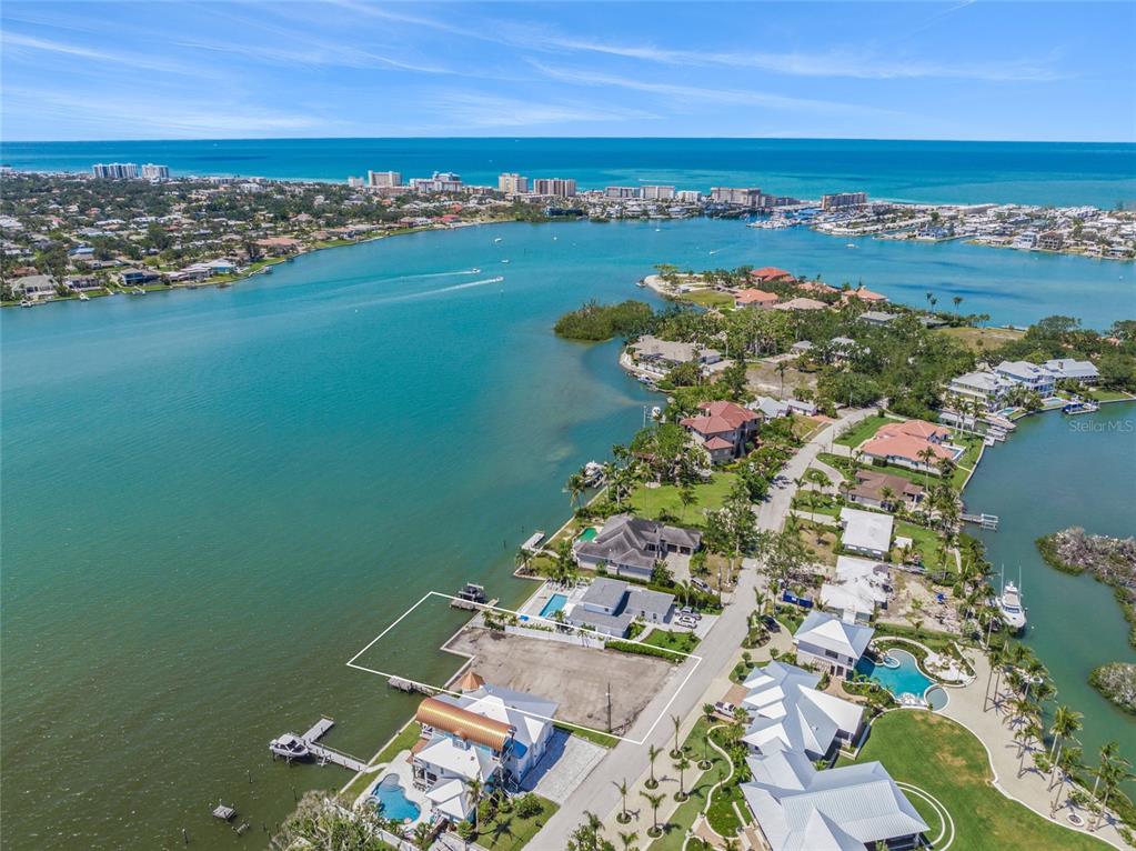 An aerial view of a vacant waterfront lot with a boat dock on the bay — 325 SUNRISE DRIVE, NOKOMIS, FL