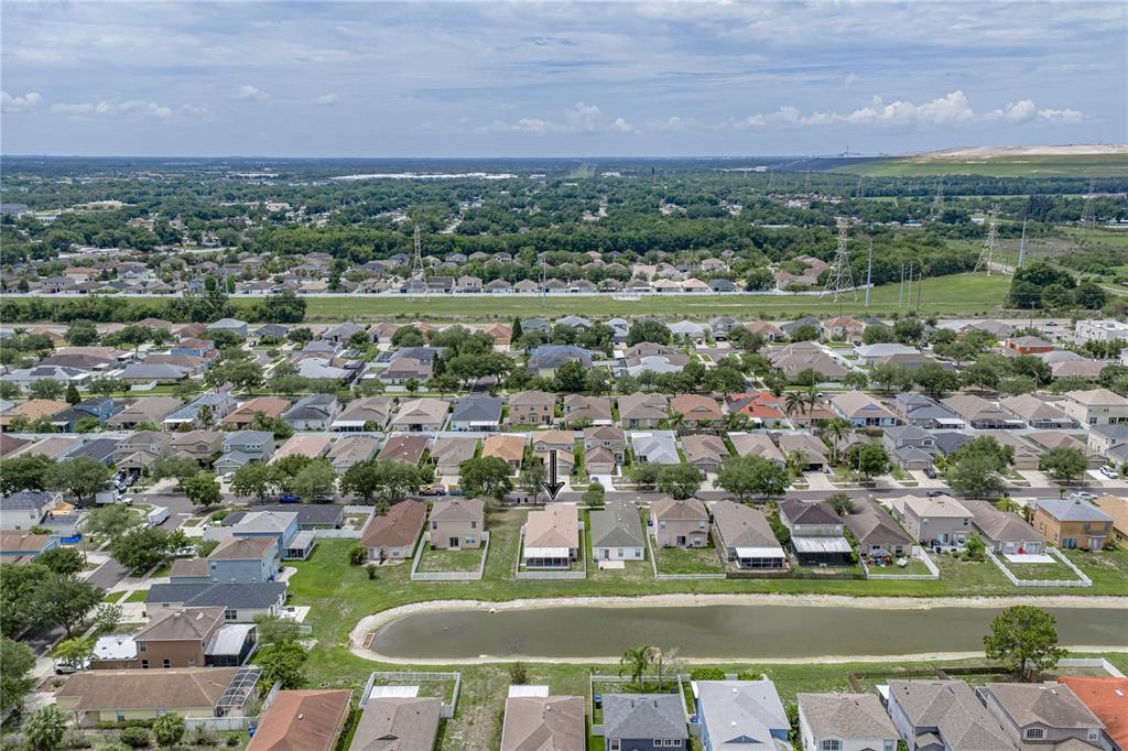 An aerial view shows a suburban neighborhood with a house marked by an arrow — 8160 CANTERBURY LAKE BOULEVARD, TAMPA, FL