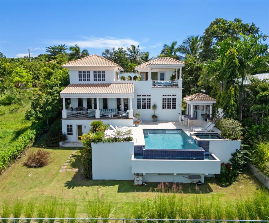 A multi-story white villa features a swimming pool, a covered patio, and a gazebo — 1 COLINA LINDA- "TRANQUILO", RINCON, PR