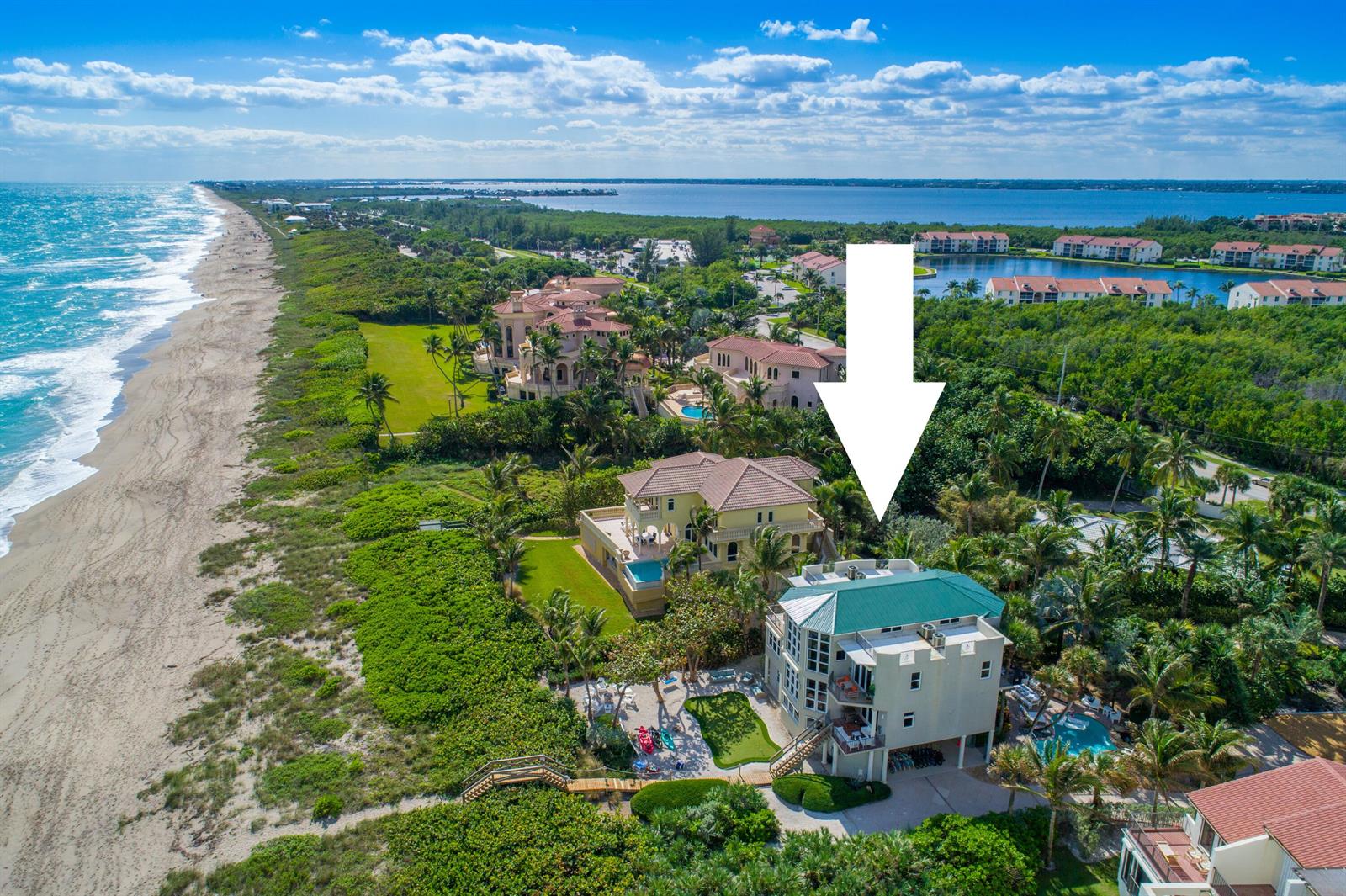 An aerial view of a coastal property featuring two large houses near the beach — 4643 NE Ocean Boulevard, Jensen Beach FL 34957, JENSEN BEACH, FL