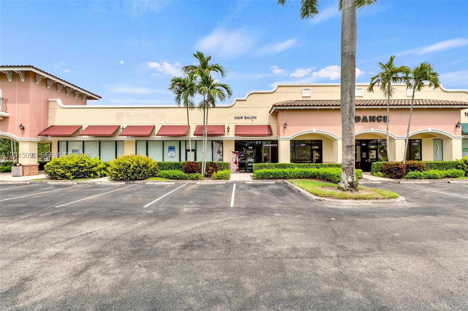 A commercial strip mall building with a hair salon and dance studio under a blue sky — 6370 N State Road 7, Coconut Creek FL 33073, COCONUT CREEK, FL