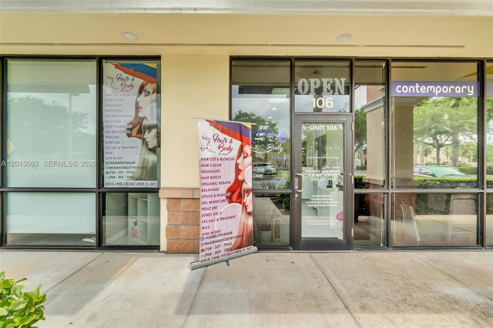 The exterior of a commercial storefront features glass doors and windows with salon signage — 6370 N State Road 7, Coconut Creek FL 33073, COCONUT CREEK, FL