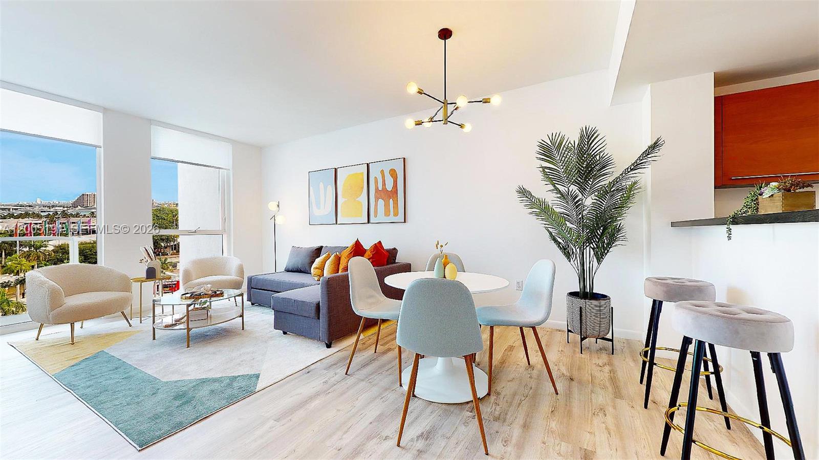 A modern living and dining area features a gray sectional, dining set, and large windows — 244 Biscayne Blvd # 704, Miami FL 33132, MIAMI, FL