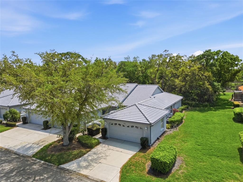 A single-story house with a gray tile roof and a two-car garage — 5721 CASA DEL SOL BOULEVARD UNIT 3223, SARASOTA, FL