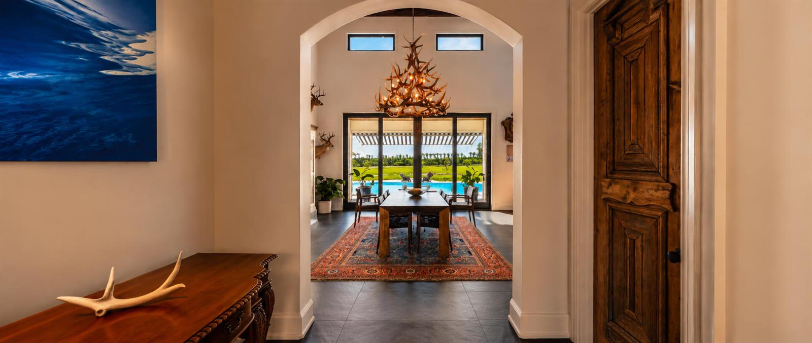 A two-story house with a pool, patio, fire pit, and lounge chairs in the backyard — 26209 SW Jockeys Run, Okeechobee FL 34974, OKEECHOBEE, FL