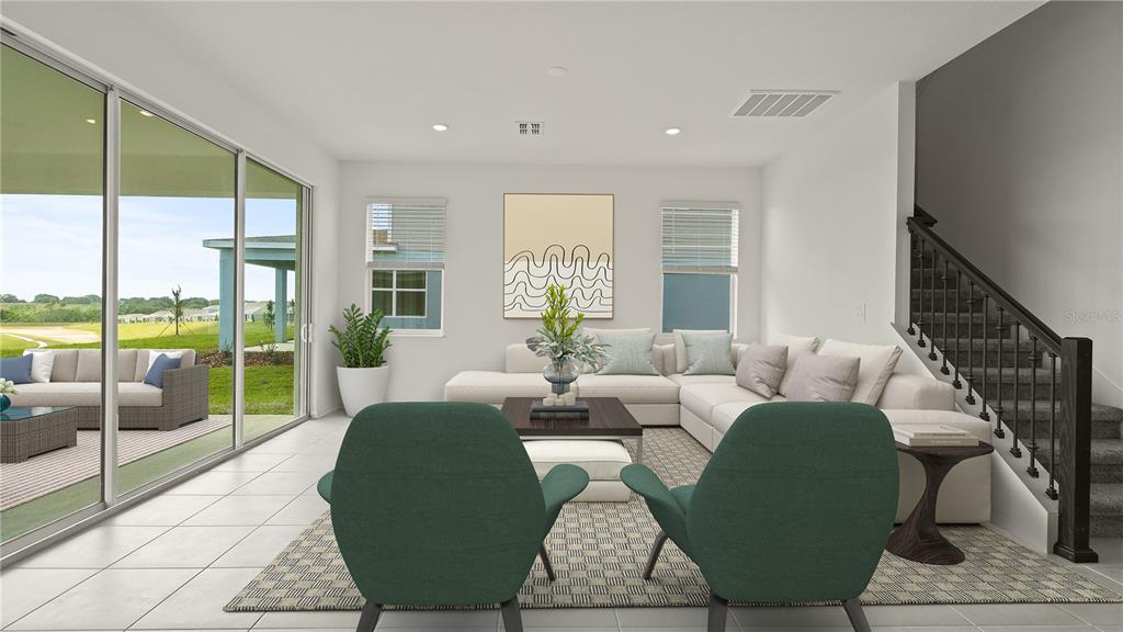 This is a digital rendering of a living room with a sectional, stairs, and patio access — 3180 NAMASTE DRIVE, CLERMONT, FL