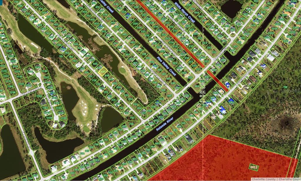 This is an aerial map showing residential lots, streets, and waterways in a neighborhood — 21 PINE VALLEY COURT, ROTONDA WEST, FL