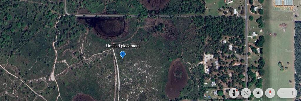 This is a satellite map view showing a wooded lot with trails and small ponds — SHORE DRIVE, LAKE WALES, FL