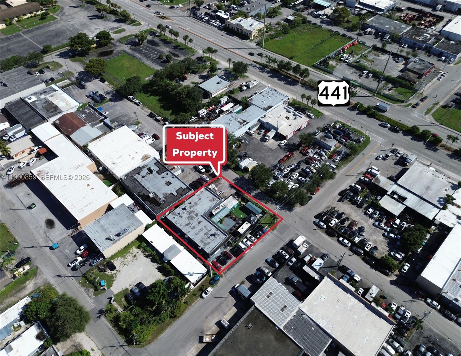 An aerial view shows a commercial property outlined in red within a dense urban area — 2220 SW 60th Ter, Miramar FL 33023, MIRAMAR, FL