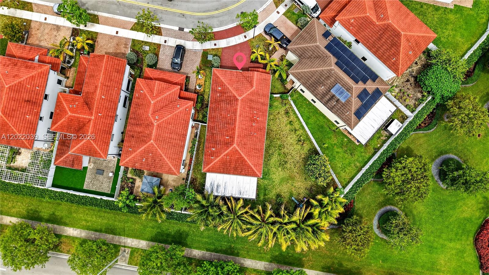 An aerial view shows several houses with red tile roofs and private backyards — 10400 W 35 Way, Hialeah FL 33018, HIALEAH, FL