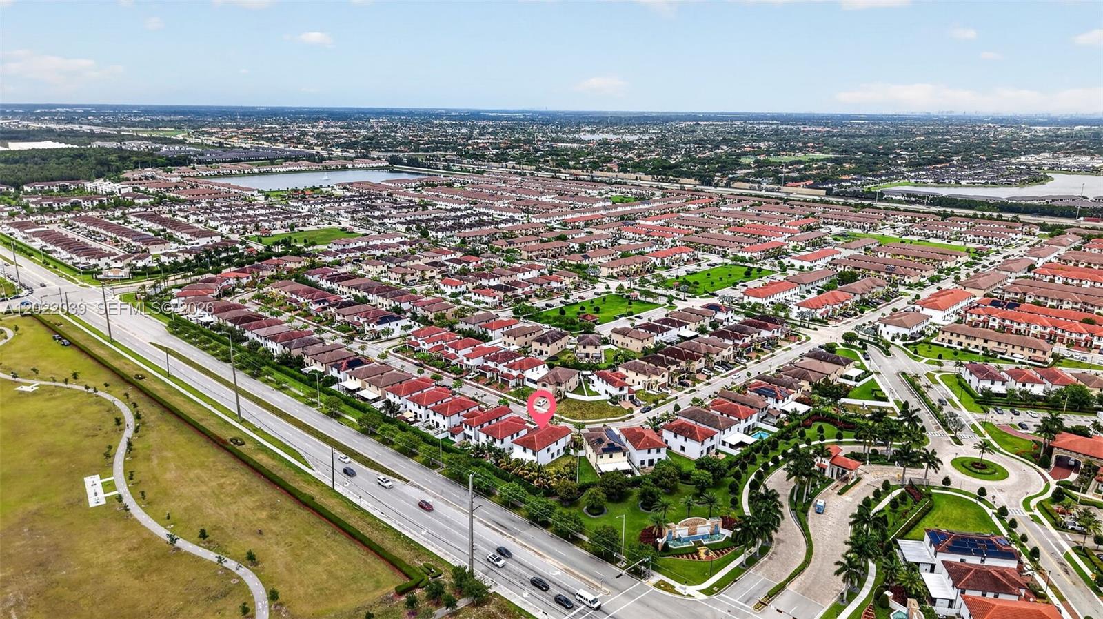 An aerial view shows a residential neighborhood with a highlighted house near a main road — 10400 W 35 Way, Hialeah FL 33018, HIALEAH, FL