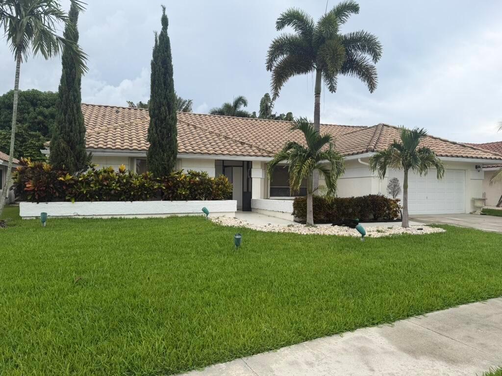 A single-story house with a tiled roof, palm trees, and a manicured front lawn — 9553 Majestic Way, Boynton Beach FL 33437, BOYNTON BEACH, FL