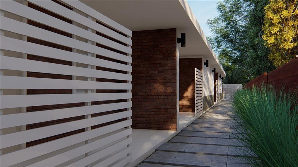 A rendering of a modern building exterior featuring brick walls, white slatted screens, and walkways — 201 NW 12th Street # 1, Pompano Beach FL 33060, POMPANO BEACH, FL