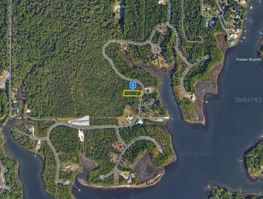This is an aerial map showing a highlighted vacant lot located along Vista del Sol Lane — 736 VISTA DEL SOL LANE, PANAMA CITY, FL