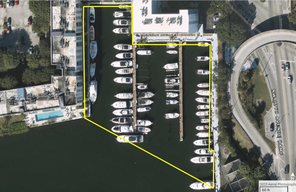 An aerial view of a marina with multiple boat slips and docked vessels — 1700 NW North River Dr, Miami FL 33125, MIAMI, FL