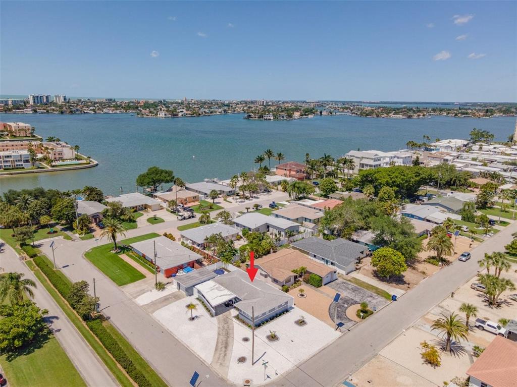 An aerial view of a single-story house with a gray roof in a coastal neighborhood — 1473 DURLING DRIVE S, SOUTH PASADENA, FL