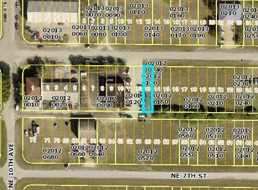 This is a satellite map showing a highlighted rectangular plot of land among other lots — 1028 NE 7TH TERRACE, CAPE CORAL, FL