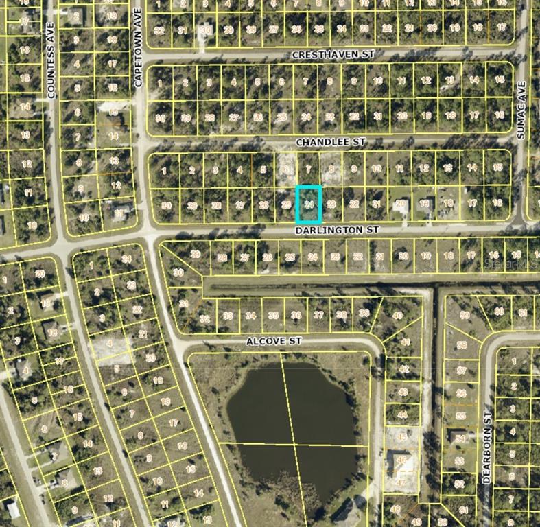 This is a map showing a highlighted vacant residential lot within a platted subdivision — 1035 DARLINGTON STREET, LEHIGH ACRES, FL