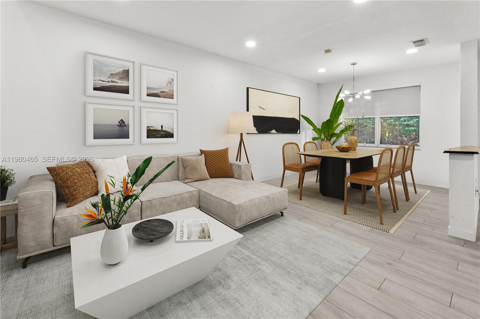 This open-concept living and dining area features light wood flooring and modern neutral furniture — 17130 SW 36th Ct, Miramar FL 33027, MIRAMAR, FL