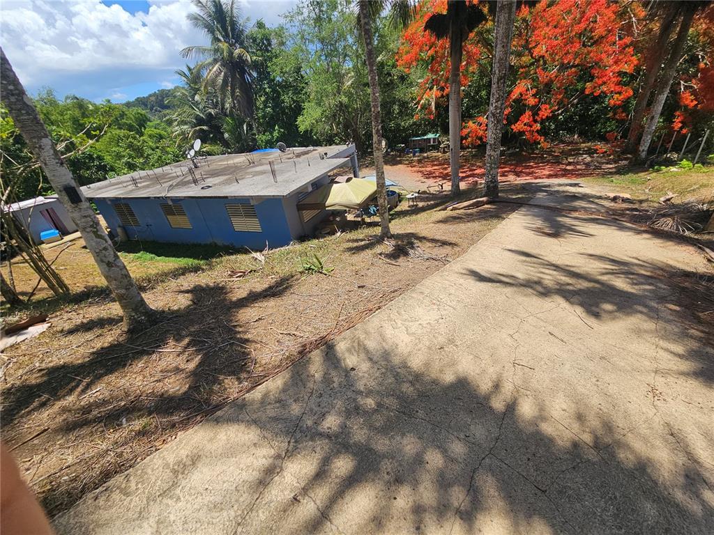 A backyard area features a small house, two outdoor canopies, and a circular above-ground pool — calle 1 CALLE 1 UNIT A 10, TRUJILLO ALTO, PR