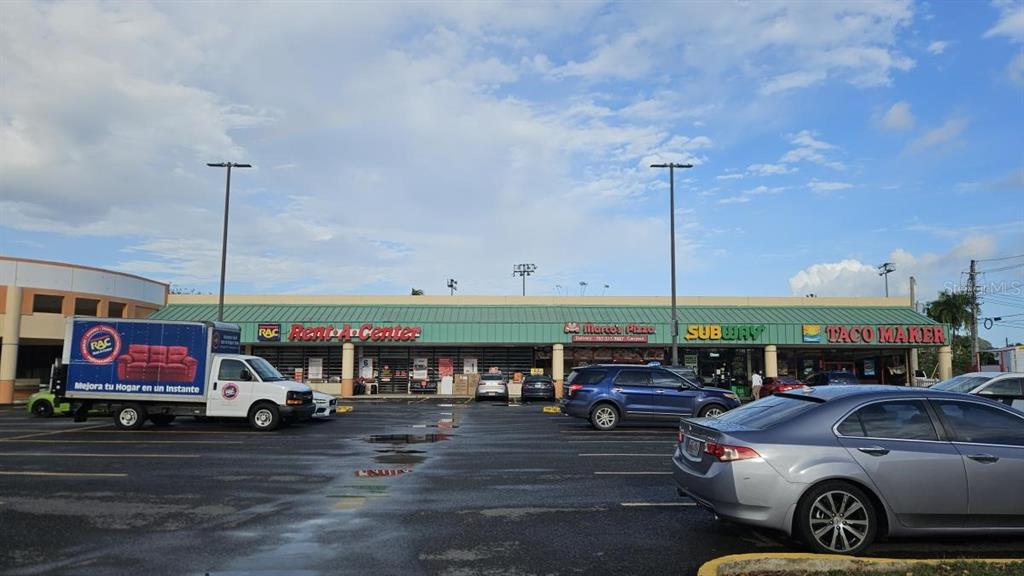 A strip mall features a Rent-A-Center, Marco's Pizza, Subway, and Taco Maker with a parking lot — 100 PR-100 KM 6.8, CABO ROJO, PR