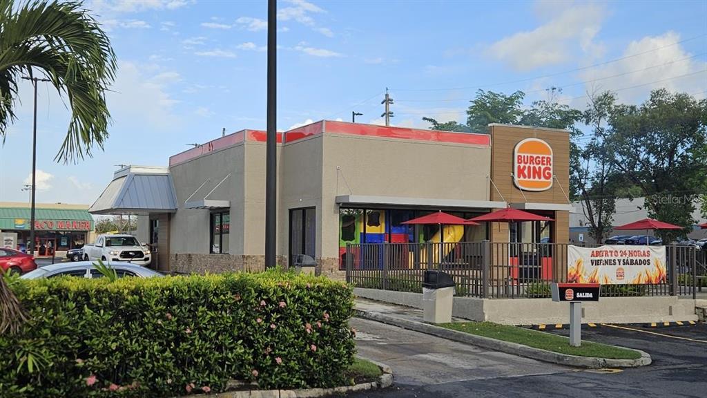 A Burger King restaurant exterior features a drive-thru lane, a playground, and a parking lot — 100 PR-100 KM 6.8, CABO ROJO, PR