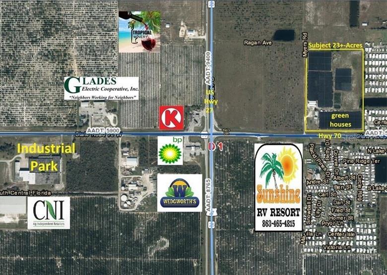 This is an aerial map showing a 23-acre property and surrounding businesses near a highway intersection — 300 STATE ROAD 70 E, LAKE PLACID, FL