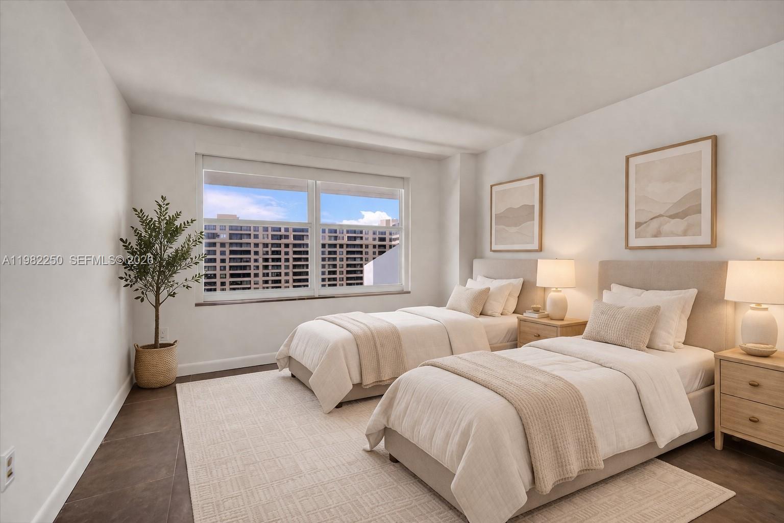 A bedroom features two twin beds, a large window, and light-colored neutral decor — 199 Ocean Lane Dr # 1009, Key Biscayne FL 33149, KEY BISCAYNE, FL
