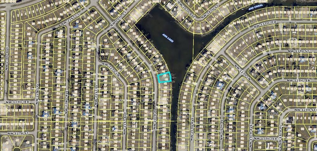 This is an aerial map showing a highlighted residential lot bordering a lake — 1213 NW 20TH PLACE, CAPE CORAL, FL